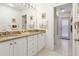Clean bathroom with double vanity and access to the backyard at 3746 Torrey Pines Blvd, Sarasota, FL 34238
