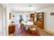 Elegant dining room featuring a wooden table and built-in hutch at 3746 Torrey Pines Blvd, Sarasota, FL 34238