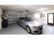 Spacious two-car garage with epoxy flooring and ample storage at 3746 Torrey Pines Blvd, Sarasota, FL 34238