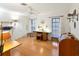 Home office with wood floors, built-in desk, and plenty of natural light at 3746 Torrey Pines Blvd, Sarasota, FL 34238
