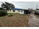 Ranch-style house with carport and a spacious yard at 39020 Heath Dr, Zephyrhills, FL 33542