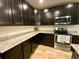 Modern kitchen with ample cabinetry and granite countertops at 4035 Wayfarer Way, Palmetto, FL 34221