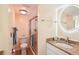 Bathroom with granite countertop, shower, and toilet at 404 Cerromar N Cir # 108, Venice, FL 34293