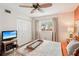 Bedroom with a ceiling fan, window, and spacious closet at 404 Cerromar N Cir # 108, Venice, FL 34293