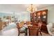 Bright dining room featuring a charming table and display cabinet at 404 Cerromar N Cir # 108, Venice, FL 34293