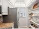 Well-equipped kitchen featuring ample storage and a pantry at 404 Cerromar N Cir # 108, Venice, FL 34293