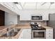 Modern kitchen with stainless steel appliances and granite countertops at 404 Cerromar N Cir # 108, Venice, FL 34293