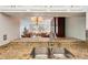 Kitchen with granite countertops and a double sink at 404 Cerromar N Cir # 108, Venice, FL 34293