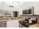 Kitchen with granite countertops and view to living room at 404 Cerromar N Cir # 108, Venice, FL 34293