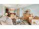 Living room with neutral decor and access to dining area at 404 Cerromar N Cir # 108, Venice, FL 34293