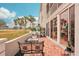 Brick patio with outdoor furniture and golf course view at 404 Cerromar N Cir # 108, Venice, FL 34293