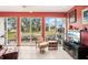Sunroom with relaxing seating and scenic backyard view at 404 Cerromar N Cir # 108, Venice, FL 34293