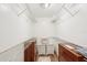 Spacious walk-in closet with wire shelving and two dressers at 404 Cerromar N Cir # 108, Venice, FL 34293