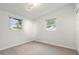 Bright bedroom with two windows and wood-look flooring at 4042 Radnor Pl, Sarasota, FL 34233