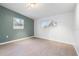 Bright and airy bedroom with neutral walls and wood-look flooring at 4042 Radnor Pl, Sarasota, FL 34233