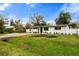House exterior with landscaping and driveway at 4042 Radnor Pl, Sarasota, FL 34233
