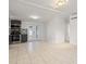 Open concept kitchen and dining area feature stainless steel appliances and tile flooring at 4042 Radnor Pl, Sarasota, FL 34233