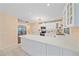 Modern kitchen with white cabinets and a large island at 424 Cezanne Dr, Osprey, FL 34229