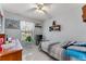Small bedroom with twin bed and built-in shelving at 4363 Melis St, Port Charlotte, FL 33948