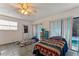 Bright bedroom with two beds and access to a patio at 4363 Melis St, Port Charlotte, FL 33948