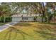 Charming single story home with a well-manicured lawn at 4363 Melis St, Port Charlotte, FL 33948