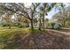 Ranch style home with mature landscaping and a spacious front yard at 4363 Melis St, Port Charlotte, FL 33948