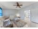 Living room with white sectional sofa and view of kitchen at 4363 Melis St, Port Charlotte, FL 33948