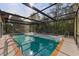 Refreshing pool with a covered patio, perfect for relaxation at 4363 Melis St, Port Charlotte, FL 33948