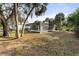 Relaxing screened pool area with lush landscaping at 4363 Melis St, Port Charlotte, FL 33948