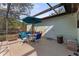 Relaxing pool area with patio furniture under a covered patio at 4363 Melis St, Port Charlotte, FL 33948