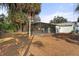 Spacious backyard with a screened-in pool at 4363 Melis St, Port Charlotte, FL 33948