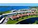 Aerial view of waterfront community highlighting a specific condo building near the water at 4799 Independence Dr, Bradenton, FL 34210