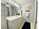 Clean bathroom with vanity, large mirror, and shower at 4799 Independence Dr, Bradenton, FL 34210