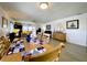 Dining area featuring a light wood table with nautical placemats at 4799 Independence Dr, Bradenton, FL 34210