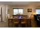 Dining area with a light wood table and chairs, overlooking a waterfront view at 4799 Independence Dr, Bradenton, FL 34210