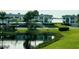 Community view, featuring waterfront, lush landscaping, and parking at 4799 Independence Dr, Bradenton, FL 34210