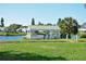 White gazebo with green roof near a pond at 4799 Independence Dr, Bradenton, FL 34210