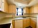 Clean kitchen with light wood cabinets and modern appliances at 4799 Independence Dr, Bradenton, FL 34210