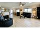 Open living area with leather furniture and a view into dining area at 4799 Independence Dr, Bradenton, FL 34210