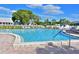 Inviting community swimming pool with plenty of lounge chairs at 4799 Independence Dr, Bradenton, FL 34210