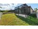 Spacious backyard with screened patio and fenced area at 491 Casalino Dr, Nokomis, FL 34275