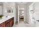 Main bathroom with double vanity, walk-in shower, and access to bedroom and toilet at 491 Casalino Dr, Nokomis, FL 34275