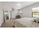 Bright bedroom featuring a workspace and large windows at 491 Casalino Dr, Nokomis, FL 34275