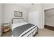 Charming bedroom with a metal bed frame and a window at 491 Casalino Dr, Nokomis, FL 34275
