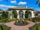Community clubhouse with fountain and landscaping at 491 Casalino Dr, Nokomis, FL 34275