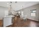 Open concept dining area with a round table and chairs, adjacent to the kitchen at 491 Casalino Dr, Nokomis, FL 34275