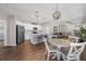 Eat-in kitchen with an island and stainless steel appliances, open to dining and living areas at 491 Casalino Dr, Nokomis, FL 34275