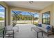 Relaxing screened patio with seating area, perfect for outdoor enjoyment at 491 Casalino Dr, Nokomis, FL 34275