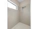 Clean and modern walk-in shower with neutral tile at 491 Casalino Dr, Nokomis, FL 34275