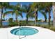 Spa at Fairfield, surrounded by palm trees and overlooking a serene pond, perfect relaxation at 5034 Maymont Park Cir, Bradenton, FL 34203